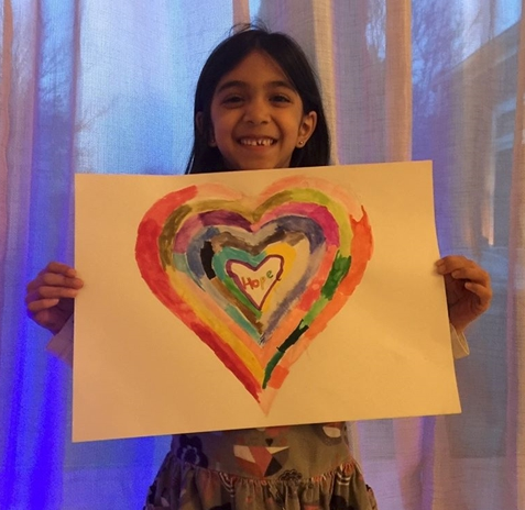 Girl with rainbow heart picture